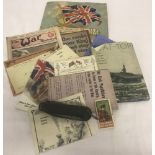 A collection of military related ephemera to include an album of Kensitas silks of National Flags