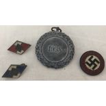 A German WWII pattern medal together with 3 German Party badges.