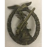 A German WWII pattern Luftwaffe flak battle badge.