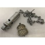 A WWII pattern Home Front A.R.P whistle on chain together with a hallmarked silver lapel badge.