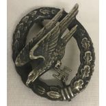 A WWII pattern German Parachutist badge.