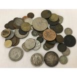 A small collection of vintage British and world coins.