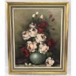 A gilt framed oil on canvas of still life flowers.