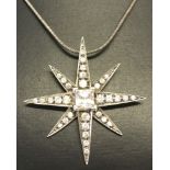 A pretty silver star shaped pendant set with clear stones on a 18 inch silver snake chain.