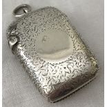 A silver vesta case with engraved flowers decoration and empty cartouche.