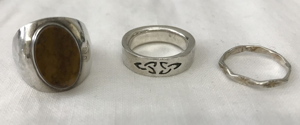 3 silver dress rings.