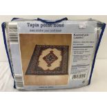 A Tapis point rug making kit for a knotted pile carpet.