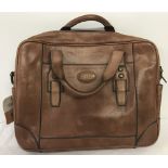 A brown leather Fossil briefcase / bag.