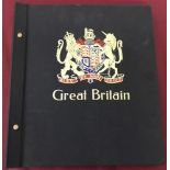 A black Stanley Gibbons Great Britain stamp album.