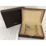 A brand new boxed dark wood jewellery box by Walwood.