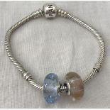 A Pandora charm bracelet approx. 17cm long with 2 Murano glass charm beads.