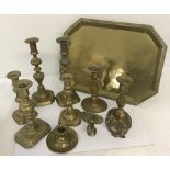 A small quantity of vintage brass items to include 3 pairs of candlesticks and a tray.