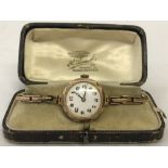 A ladies vintage 9ct gold watch with 9ct gold expandable strap.