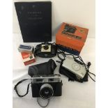 A box of vintage cameras.