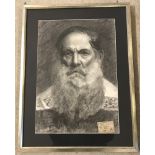 A framed and glazed charcoal portrait of a gentleman.