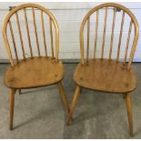 2 vintage Ercol style slat back chairs in light wood finish.