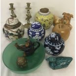 A collection of assorted oriental items to include ceramic ginger jars and brass candle sticks.