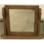 A modern pine framed table top swing mirror.