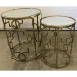 A nest of 2 mirror topped metal framed circular tables.