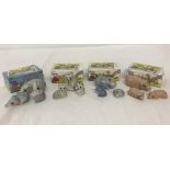 4 sets of Wade ceramic Happy Families figurines in original boxes.