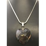 A large smoked quartz heart shaped pendant on a 925 silver omega chain.