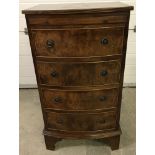 A vintage bow fronted walnut veneer 4 draw chest.