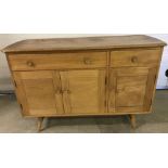 A vintage Ercol "Windsor" elm 3 door 2 drawer sideboard.