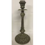 A large metal candlestick centre piece.