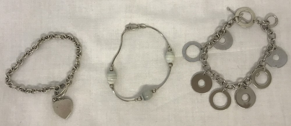 3 ladies silver bracelets.