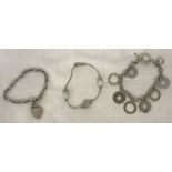 3 ladies silver bracelets.