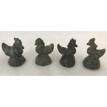 4 vintage Opium weights in the shape of birds.