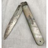 A silver fruit knife with mother of pearl handle and oval empty cartouche.