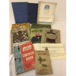 A box of mixed vintage programmes, brochures and cartoon books.