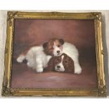 A gilt frames oil on canvas of 2 puppies.