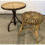 A cane topped circular occasional table on tripod feet