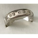 A 925 silver band ring with hallmarked decoration.