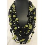 A 5 strand natural jade, black spinel and green potato pearl statement necklace.
