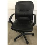 A modern black leather effect office chair on wheels with black plastic arms.