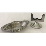 Hallmarked silver match box stand together with a silver oval shaped pin dish.