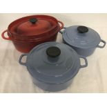 3 heavy cast lidded casserole pots.