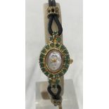 A ladies 925 silver gilt wristwatch set with emeralds by Gems.