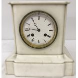 A vintage white marble mantel clock with enamelled face.