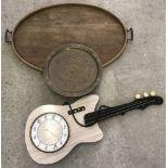 A vintage oval shaped 2 handled wooden tray together with an oriental brass tray