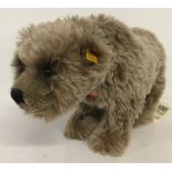 A Steiff 'Grizzly Bear' soft toy.