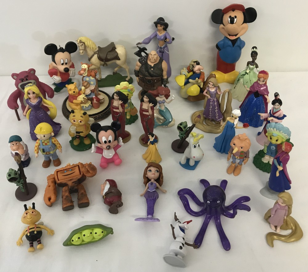 A quantity of assorted plastic figurines and toys, mostly Disney.