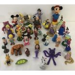 A quantity of assorted plastic figurines and toys, mostly Disney.