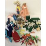 Sindy and Barbie dolls & clothing together with Sylvanian Family figures and accessories.