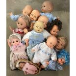 A box of vintage soft body dolls.