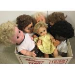 A collection of 6 larger vinyl vintage dolls.