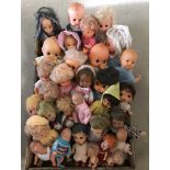 A box of vintage small vinyl dolls to include kewpie.
